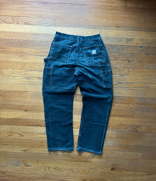 色あせ加工とダメージ加工を施したブラックのカーハート ダブルニーパンツ - 28 x 28.5