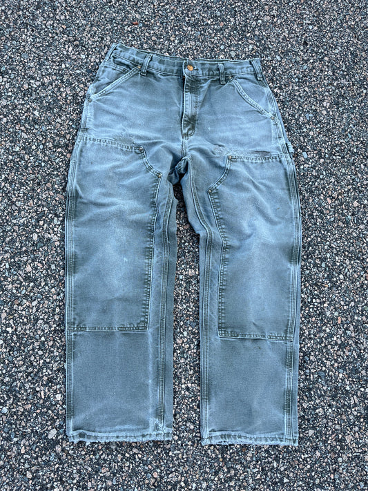 色あせたオリーブグリーンのカーハート ダブルニーパンツ - 32 x 28