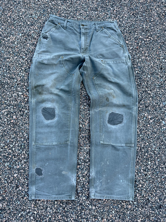 色あせたオリーブグリーンのカーハート ダブルニーパンツ - 33 x 30